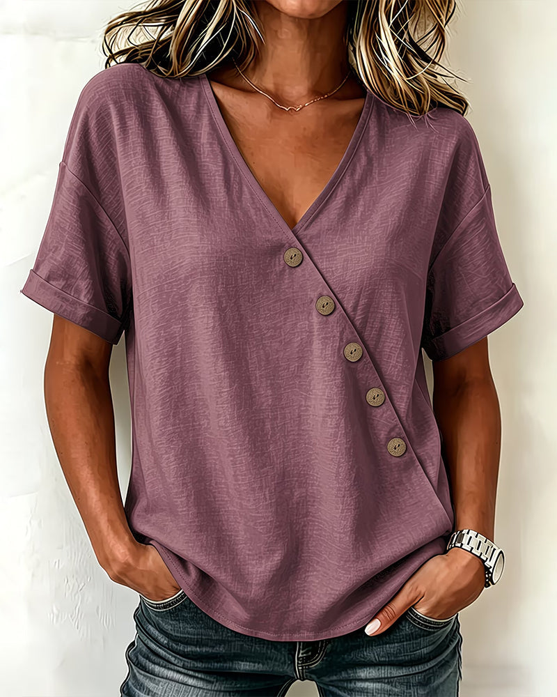 Woman smiling, wearing the khaki asymmetrical button blouse, perfect for a relaxed weekend look.