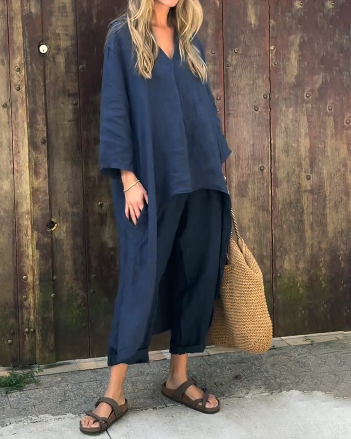 Side profile of the comfortable Adira two-piece set in a sky blue color, highlighting the tunic's flow and trouser fit.