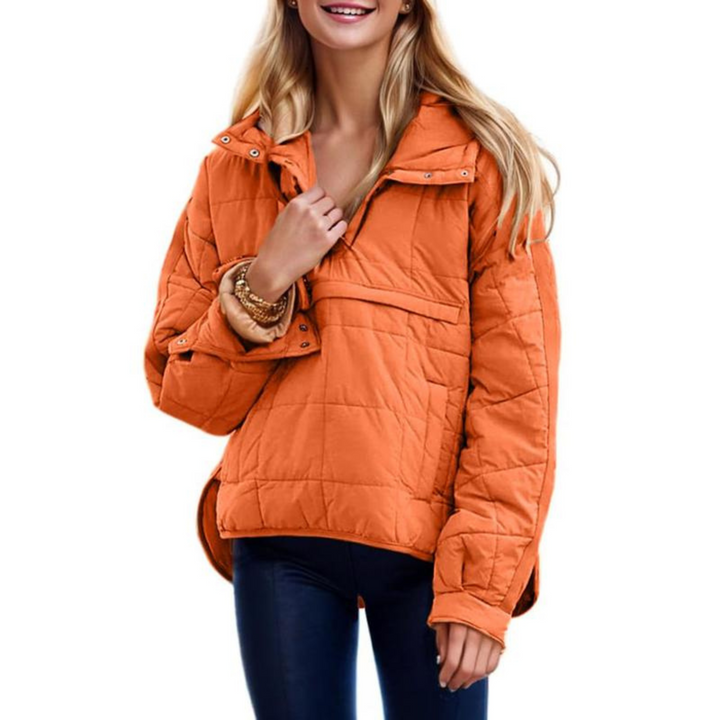 Front view of a woman wearing the dark brown oversized hooded pullover jacket, styled casually outdoors.