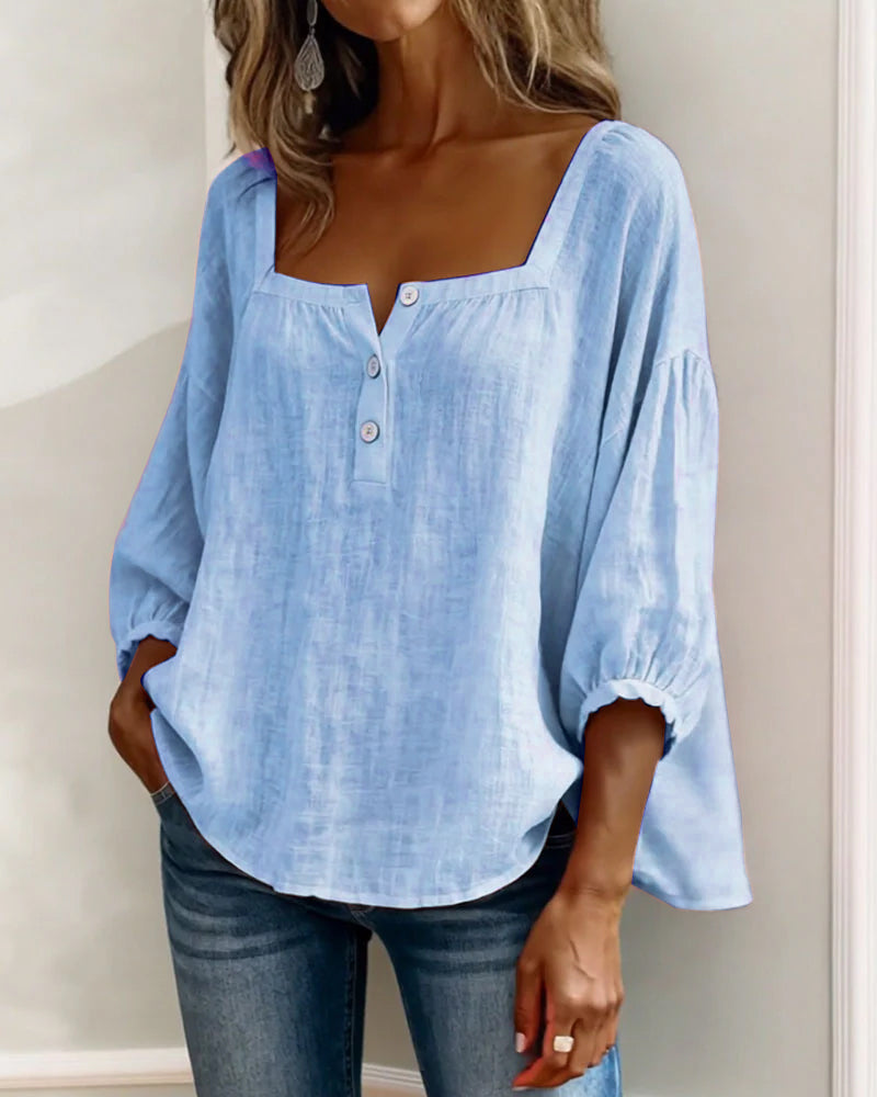 Close-up of the solid color fabric of the yellow Anya square neck blouse.
