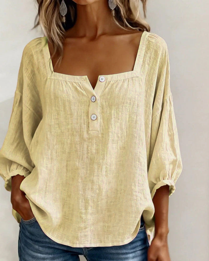 Yellow Anya square neck blouse, folded neatly for storage.