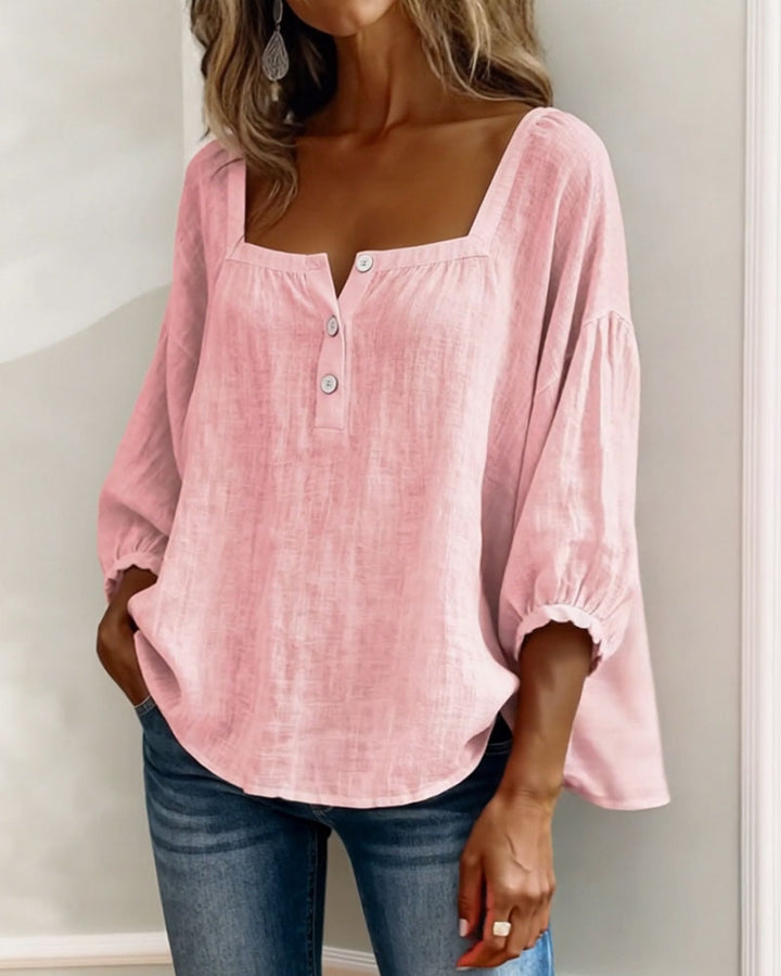 Side profile of the blue Anya blouse, highlighting the sleeve volume.