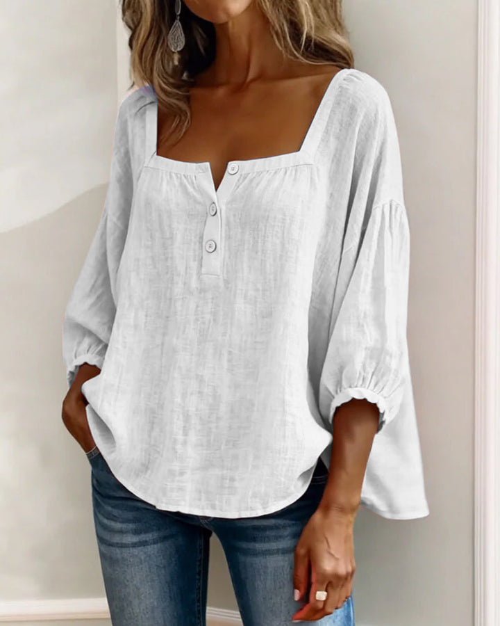 Anya blouse in pink, laid flat to display its full silhouette.