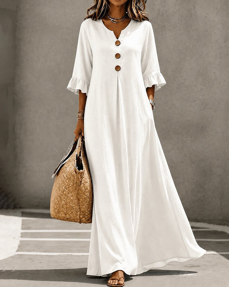 Front view of the Calandra black casual maxi dress, showcasing the V-neck and button details.