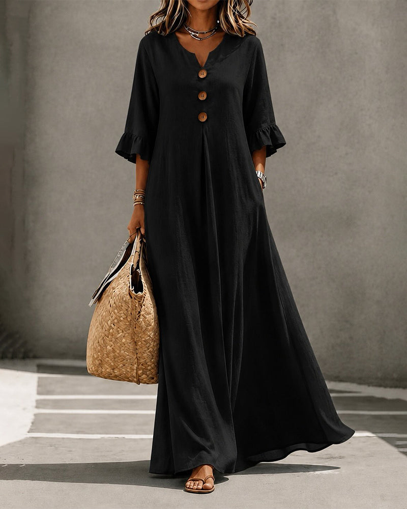 Rear view of the Calandra casual maxi dress in black, illustrating the drape and length.