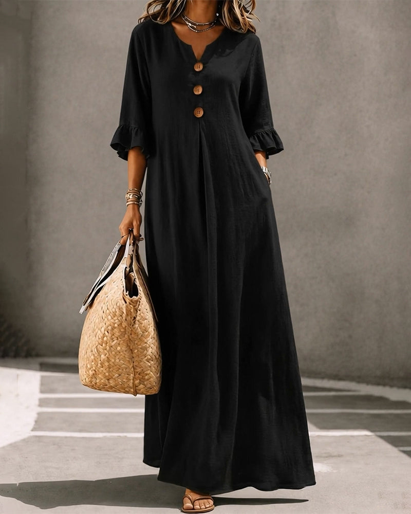 Model wearing the white Calandra dress, walking outdoors, emphasizing its comfortable movement.