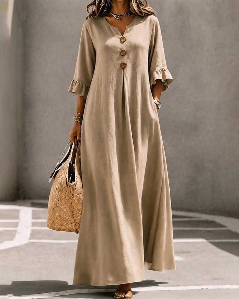 Overhead view of the Calandra black maxi dress laid flat, displaying the full skirt design.