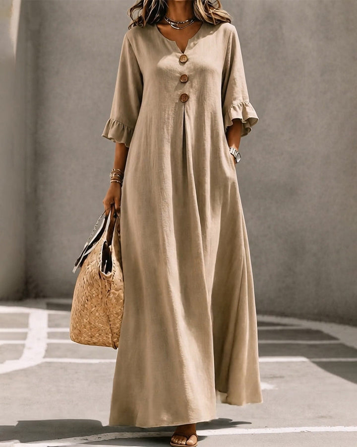 Overhead view of the Calandra black maxi dress laid flat, displaying the full skirt design.