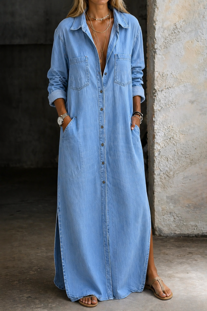 Front view of the Calista maxi button-down dress in blue denim, highlighting its flowing silhouette.