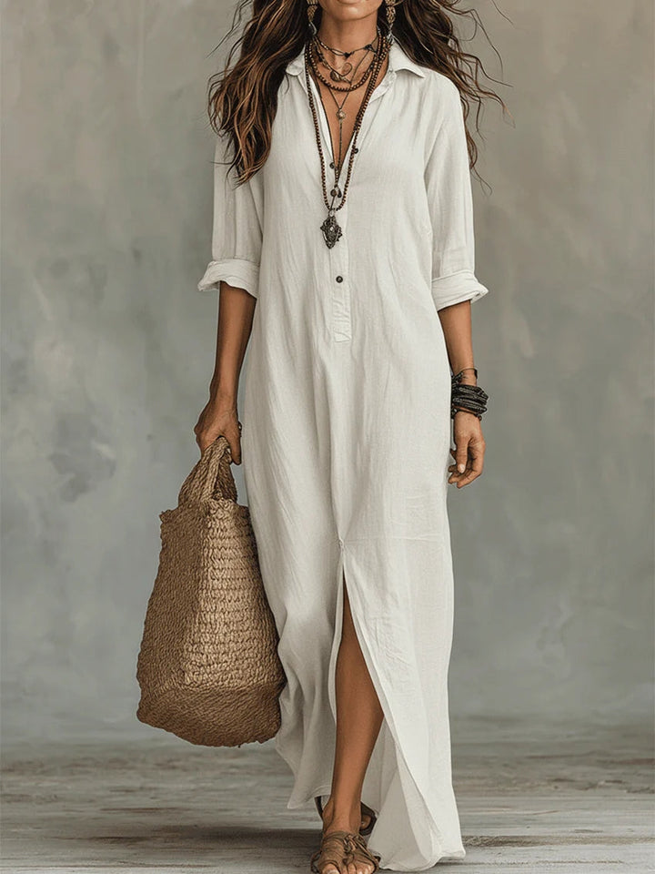 Side profile of a woman smiling, wearing the elegant Calista maxi shirt dress, highlighting its comfortable fit.