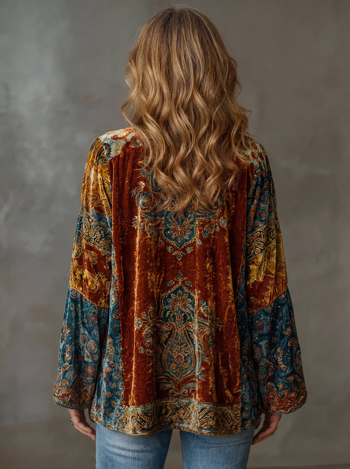 Side profile of a model wearing the Calista bohemian kimono, highlighting its wide sleeves and relaxed fit.