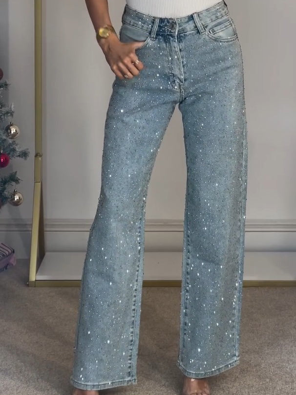 Front view of black high-waisted diamanté straight leg jeans, showcasing the sparkling embellishments.