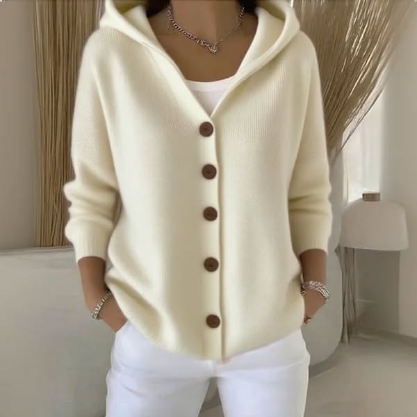 Front view of the Elara soft hooded knit cardigan in ivory cream, showcasing its relaxed fit and button details on a model.