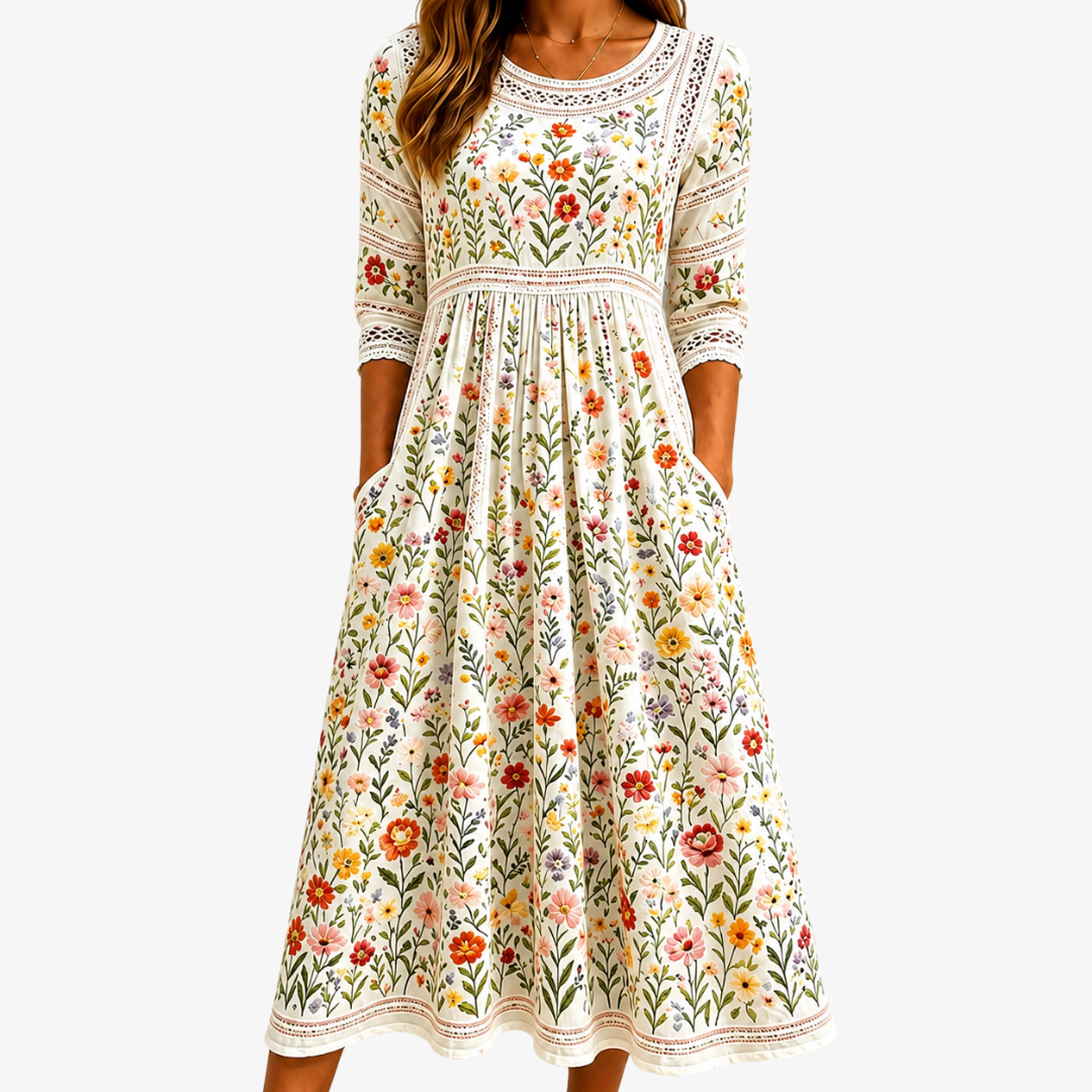 Front view of the Elara Floral Midi Dress, showcasing its vibrant botanical pattern and flowing silhouette.