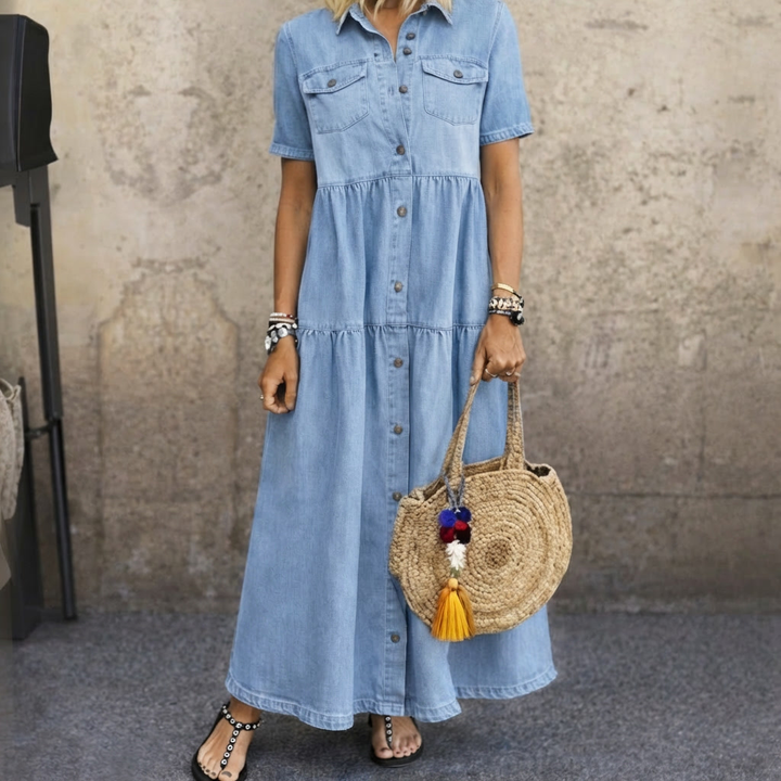 Front view of the Elara button-front midi dress in sky blue, showcasing its relaxed fit and tiered skirt.