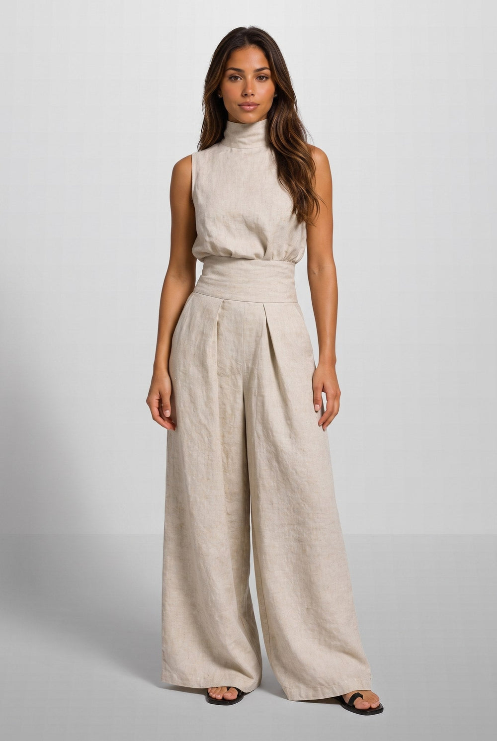 Side profile of the light blue jumpsuit, highlighting the relaxed fit and high neckline of the elegant garment.