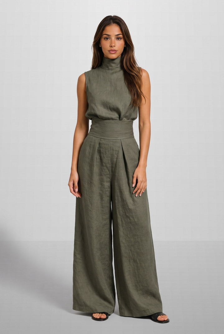A close-up detail of the breathable cotton and linen fabric texture of the light blue jumpsuit.