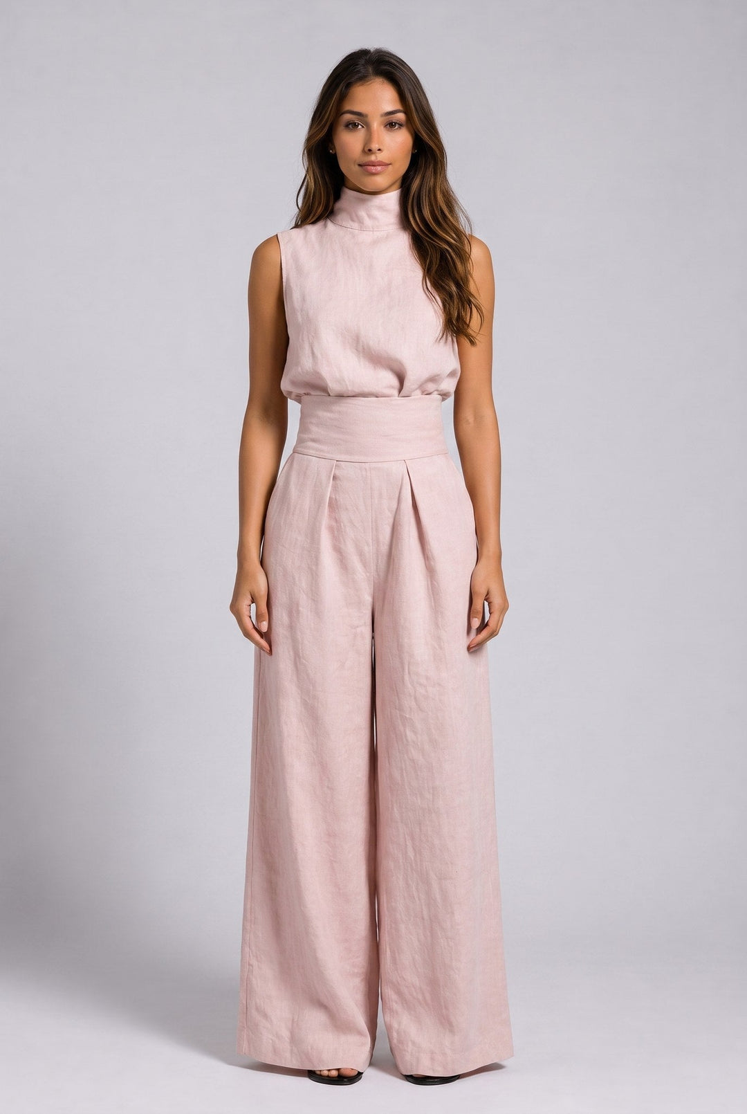 Back view of the light blue jumpsuit, emphasizing the simple, clean lines and comfortable design.