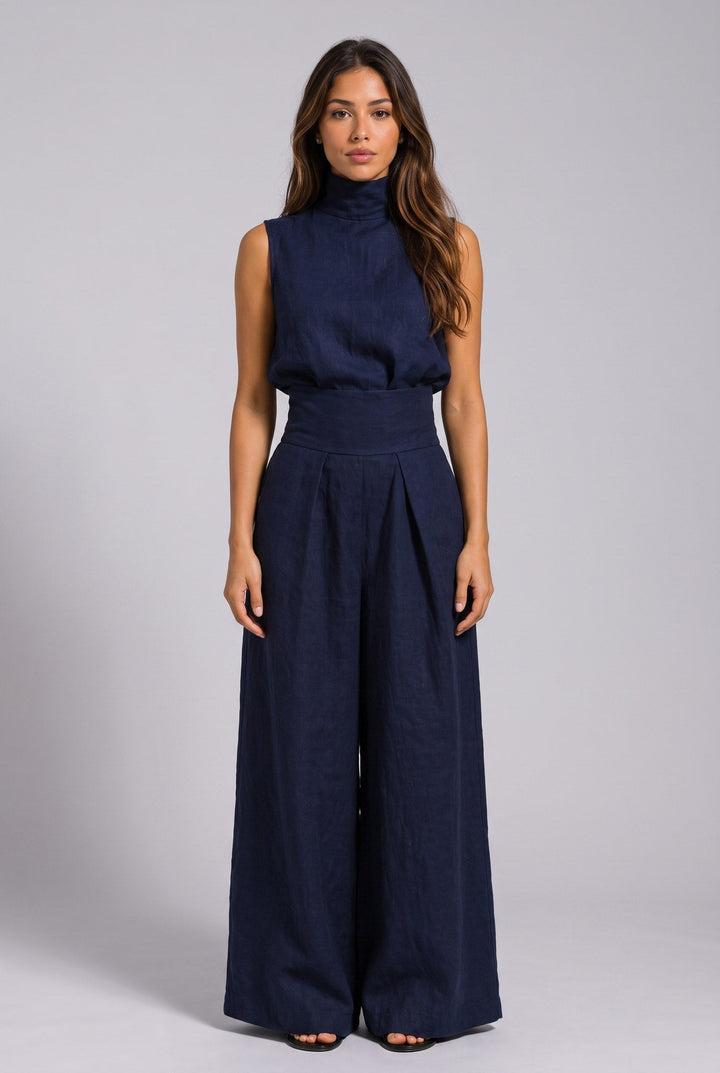 Full-body shot of the light blue jumpsuit, paired with sandals, perfect for a relaxed summer look.