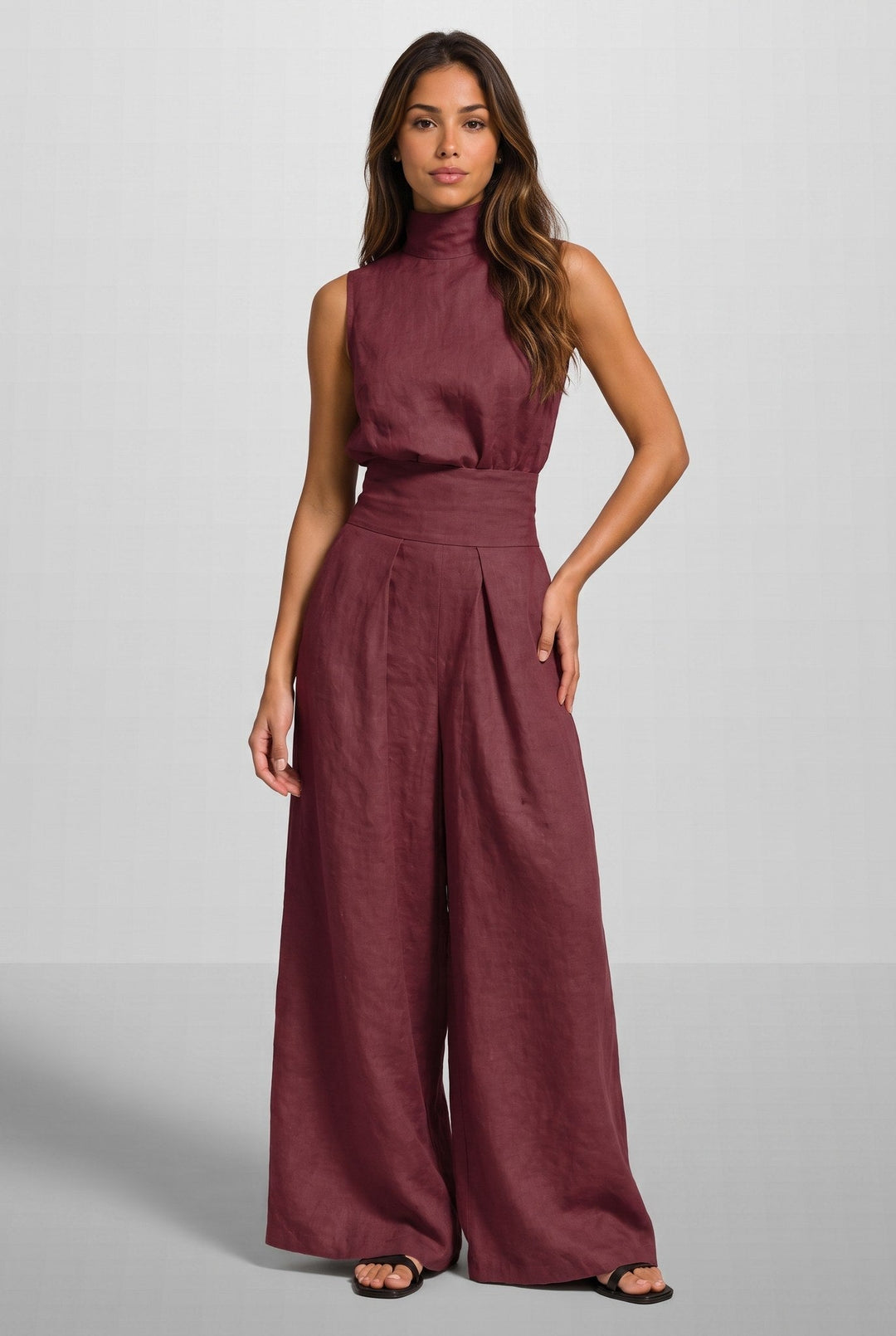 A woman in a peach-colored jumpsuit, styled for an evening out, showing the versatility of the elegant jumpsuit.