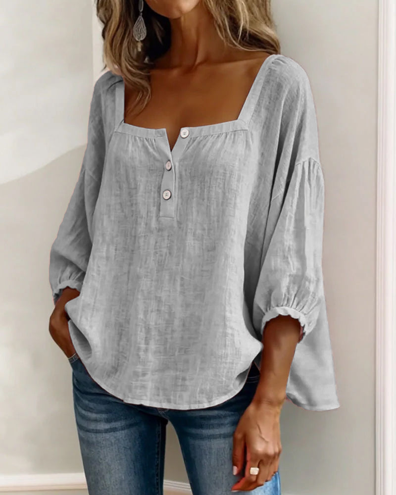 Interior view of a blue Estelle blouse, showing the clean finish and fabric quality.