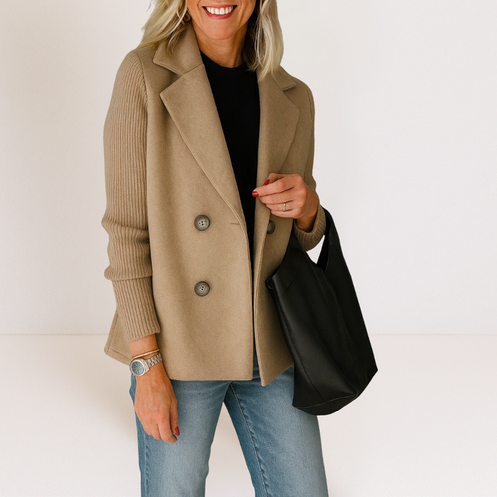Front view of the Evadne knit sleeve blazer in white, open, showing the inner lining and versatile styling.