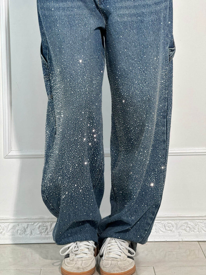 Back view of the dark blue embellished carpenter jeans, highlighting pocket details.