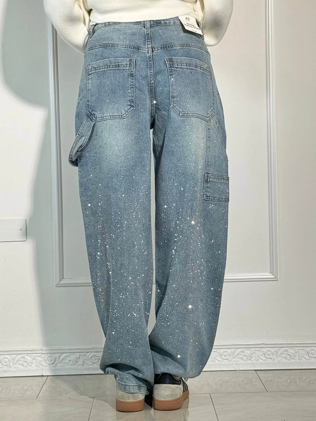 Texture of the 100% cotton material on the dark blue embellished carpenter jeans.