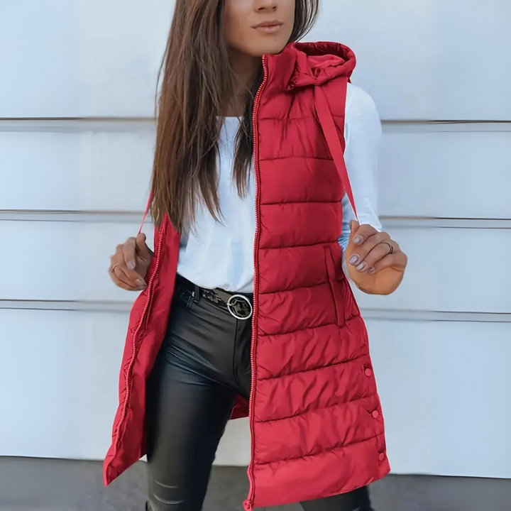 Model wearing the black puffer vest in a casual outdoor setting, demonstrating its stylish versatility.
