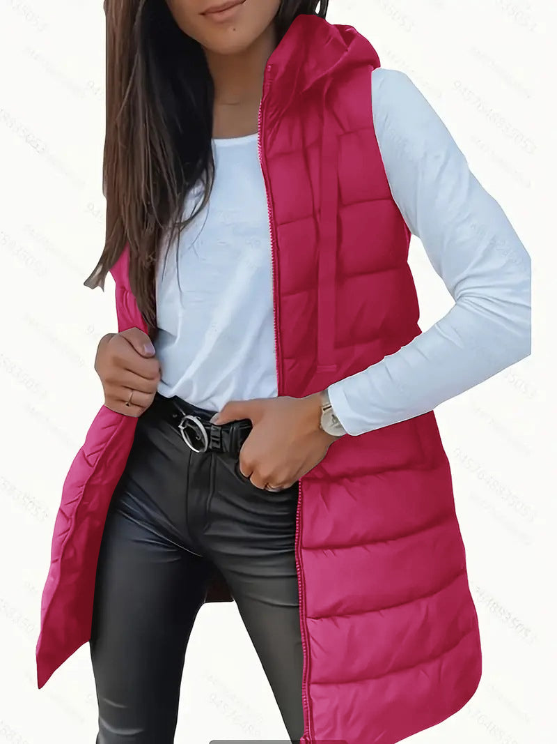 Overhead flat lay of the black sleeveless puffer vest, displaying its full form and elegant simplicity.