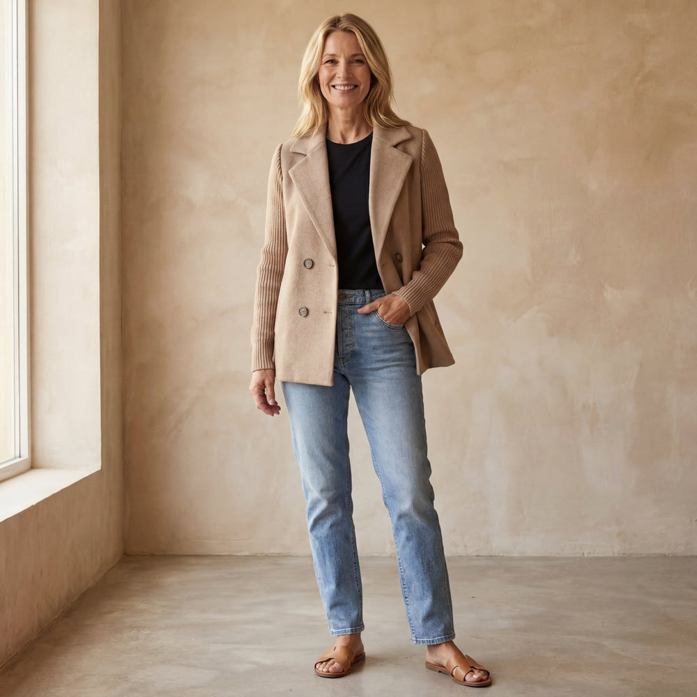 Side profile of the black Kinsley casual jacket, highlighting the ribbed knit sleeves and silhouette.