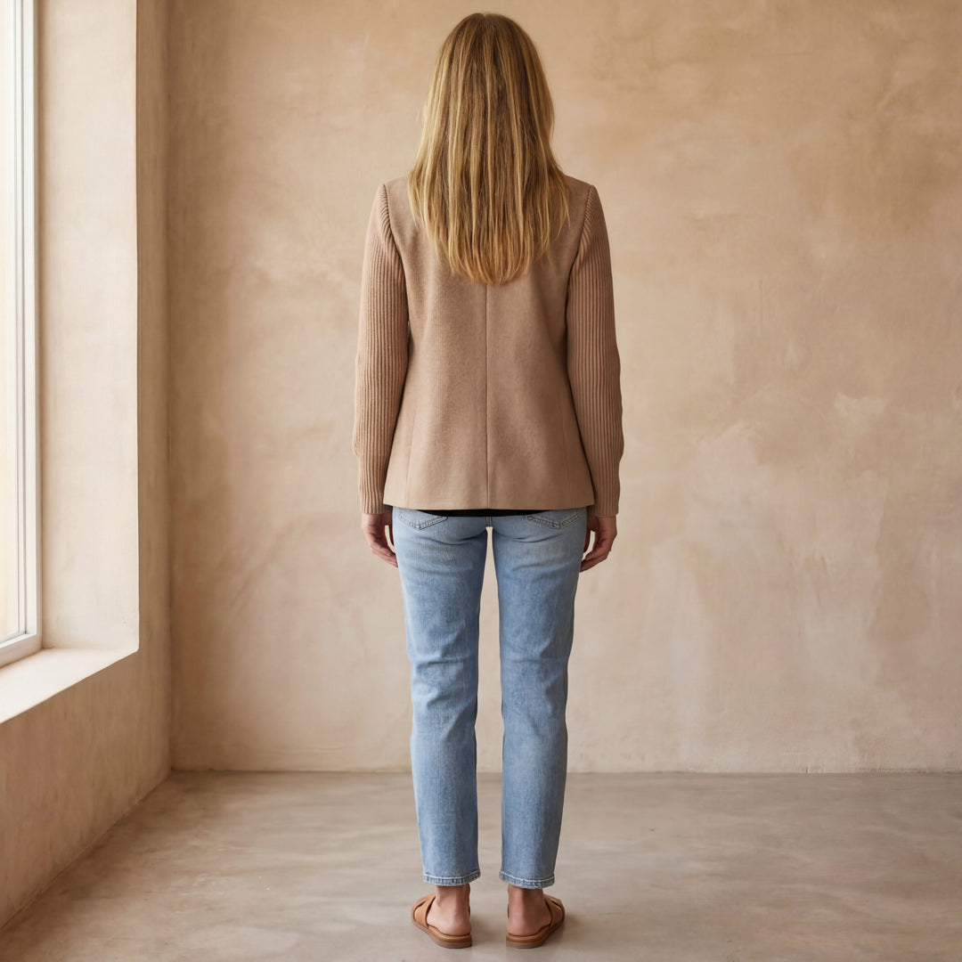 Model wearing the Kinsley casual jacket in a professional setting, paired with tailored trousers.