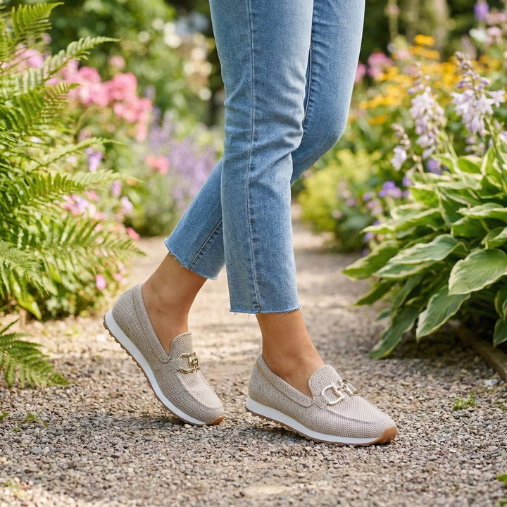 Overhead shot of the white Kira orthopedic loafer shoes, focusing on the clean lines and subtle elegance.
