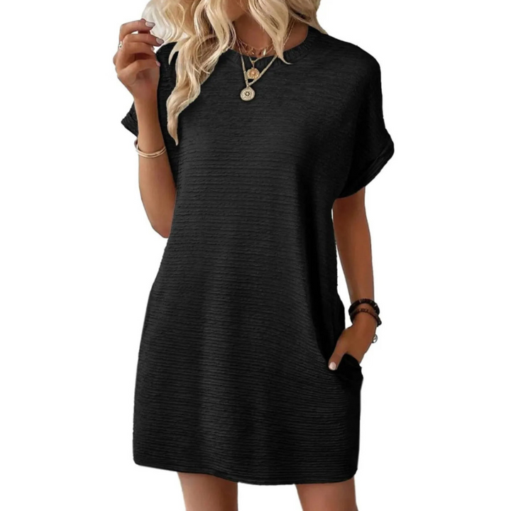 Overhead view of the Kira casual summer dress laid flat, displaying its full shape and color.