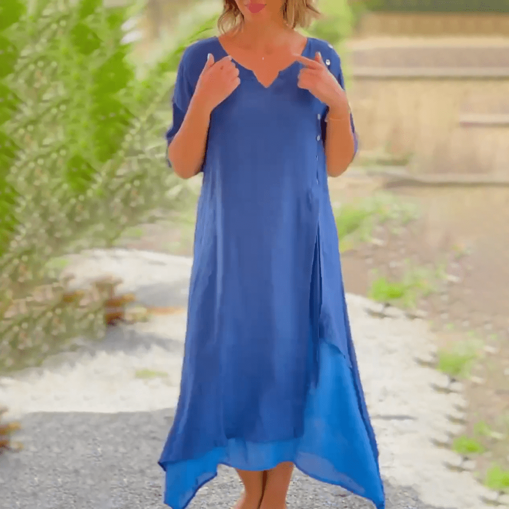 Side profile of a model showcasing the relaxed fit of the beige Liana classic maxi dress.
