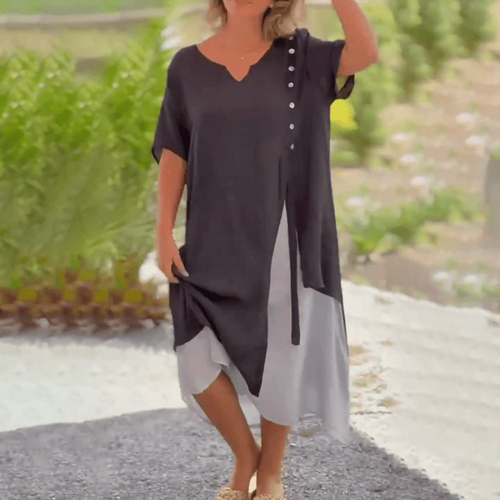 Model accessorizing the Liana classic maxi dress for a sophisticated evening look.