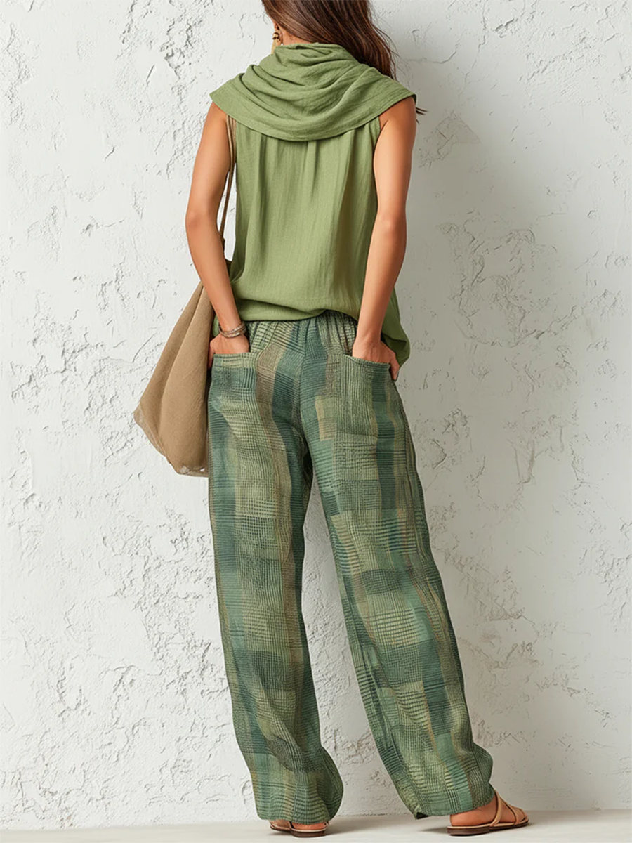 Close-up detail of the fabric and relaxed fit of the Lyra wide-leg trousers on a model.