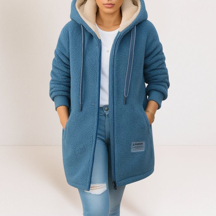 Front view of a women's fleece jacket in a vibrant blue color, showcasing its soft texture and hooded design.