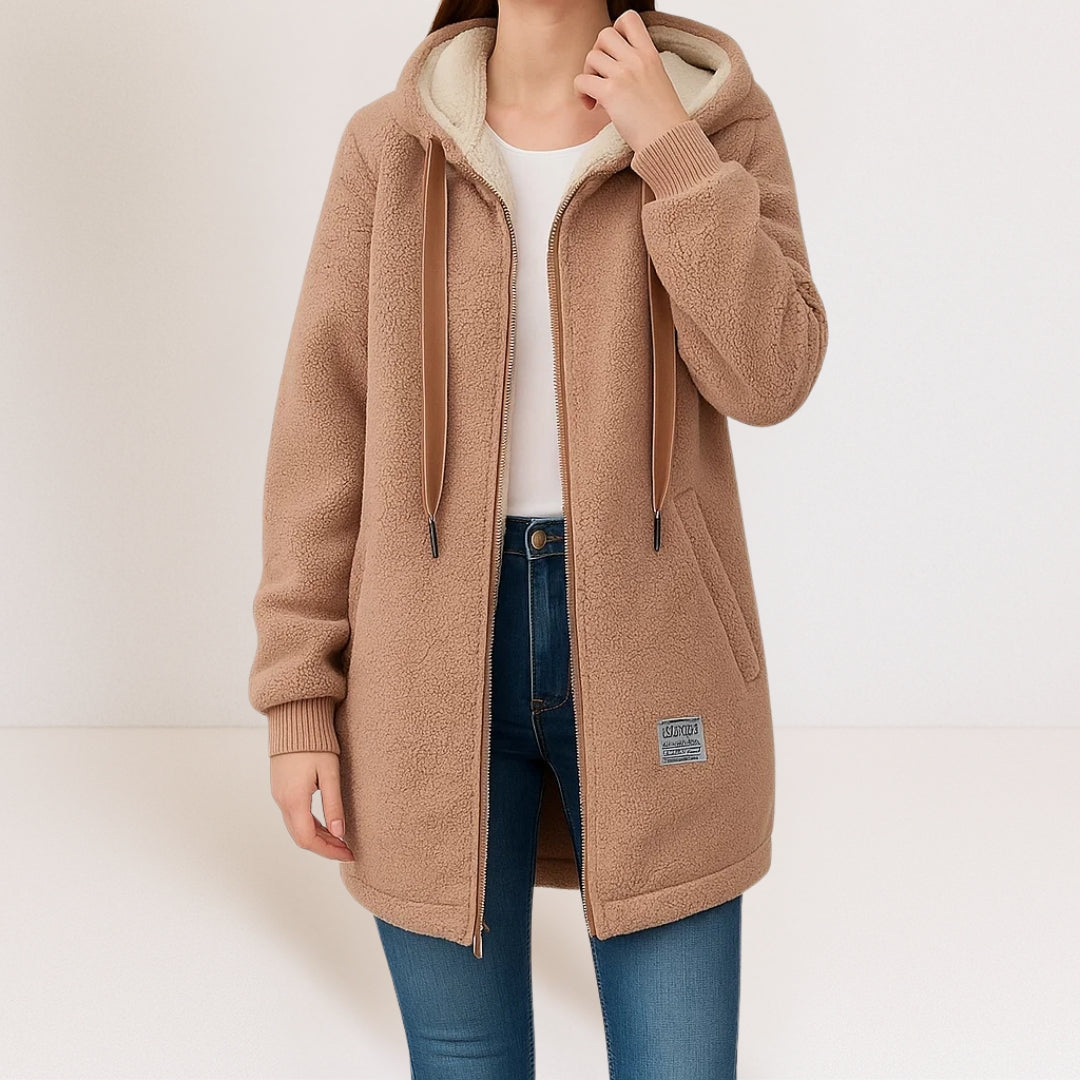 Back view of a brown hooded fleece jacket on a model, emphasizing the minimalist design and overall silhouette.