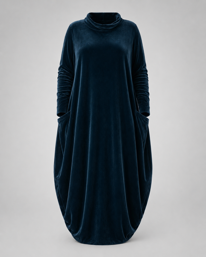 Front view of the Rosalind velvet maxi dress in dark green, showcasing its relaxed draped fit.