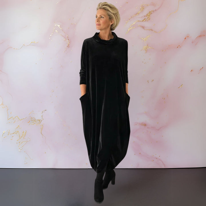 Close-up of the neckline and sleeve detail of the Rosalind velvet maxi dress.