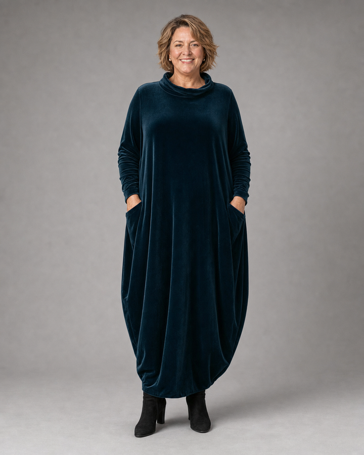 Close-up of the luxurious velvet texture on the Rosalind dress, showing its subtle sheen.