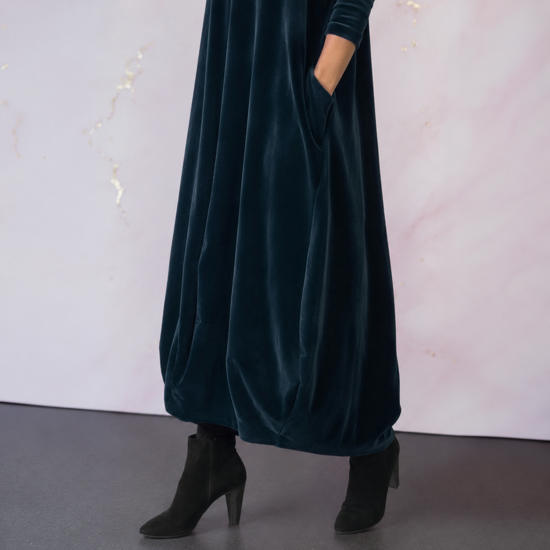Detail shot of the practical side pocket on the Rosalind velvet maxi dress.