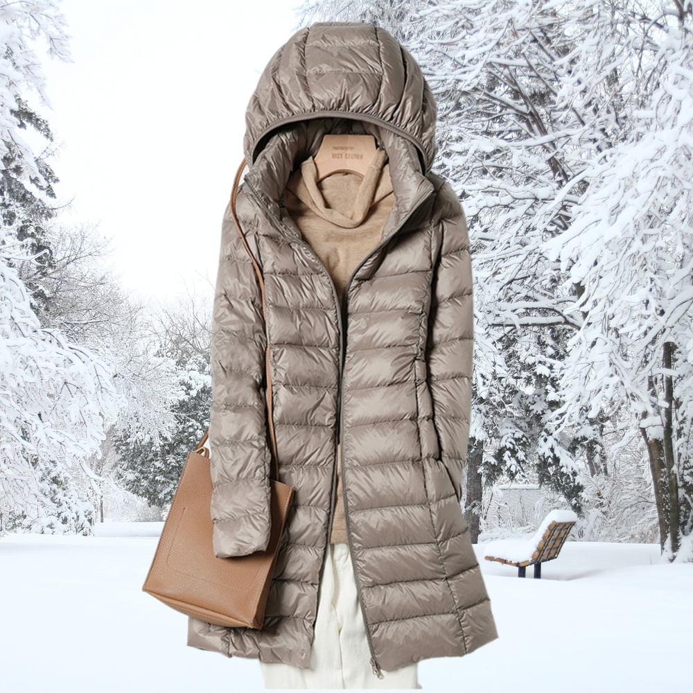 Close-up detail of the quilted pattern and zippered pocket on the Seraphina ultralight down jacket.