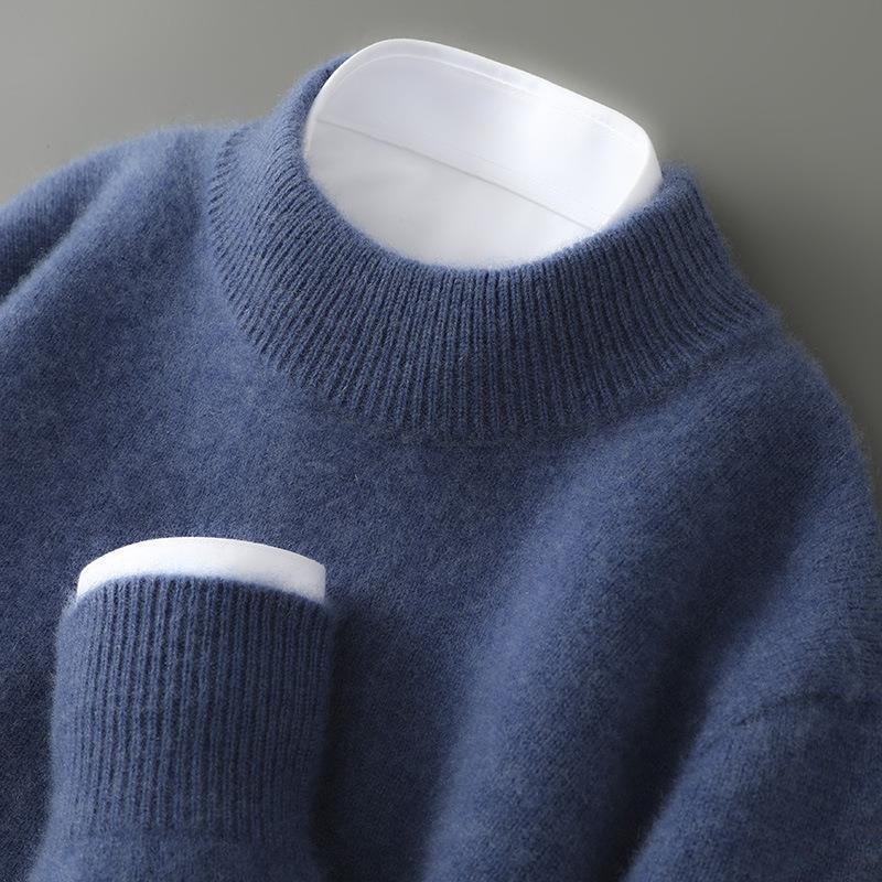 Lifestyle shot of a woman wearing a blue cashmere sweater, styled casually with jeans, emphasizing comfort.