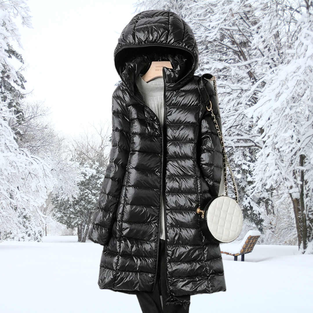 Woman wearing the black Seraphina ultralight down jacket, walking outdoors, highlighting its versatile style.