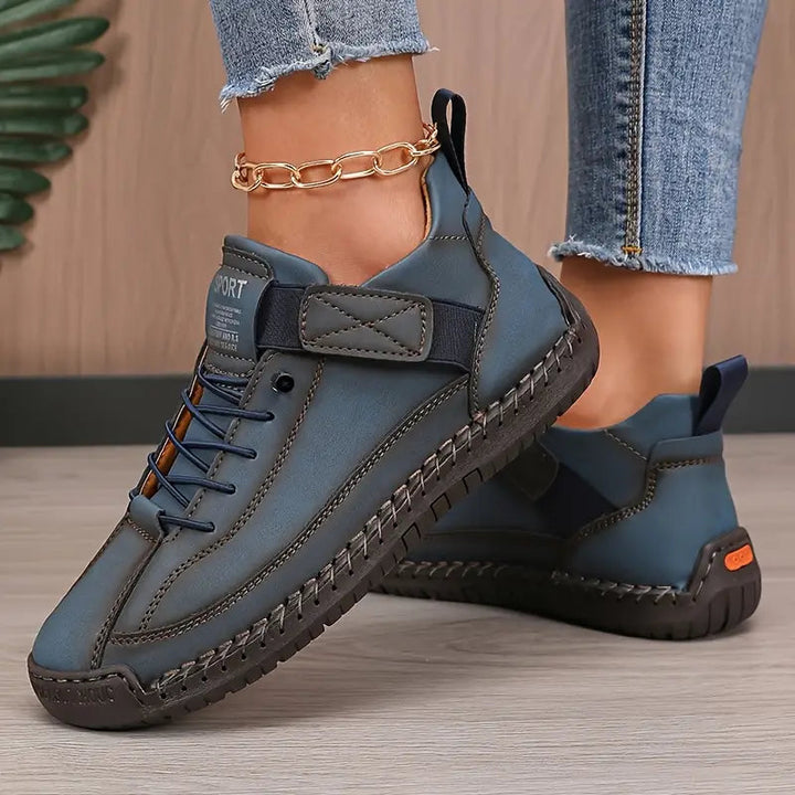 Khaki orthopedic comfort sneakers from the back angle, revealing the heel support design.