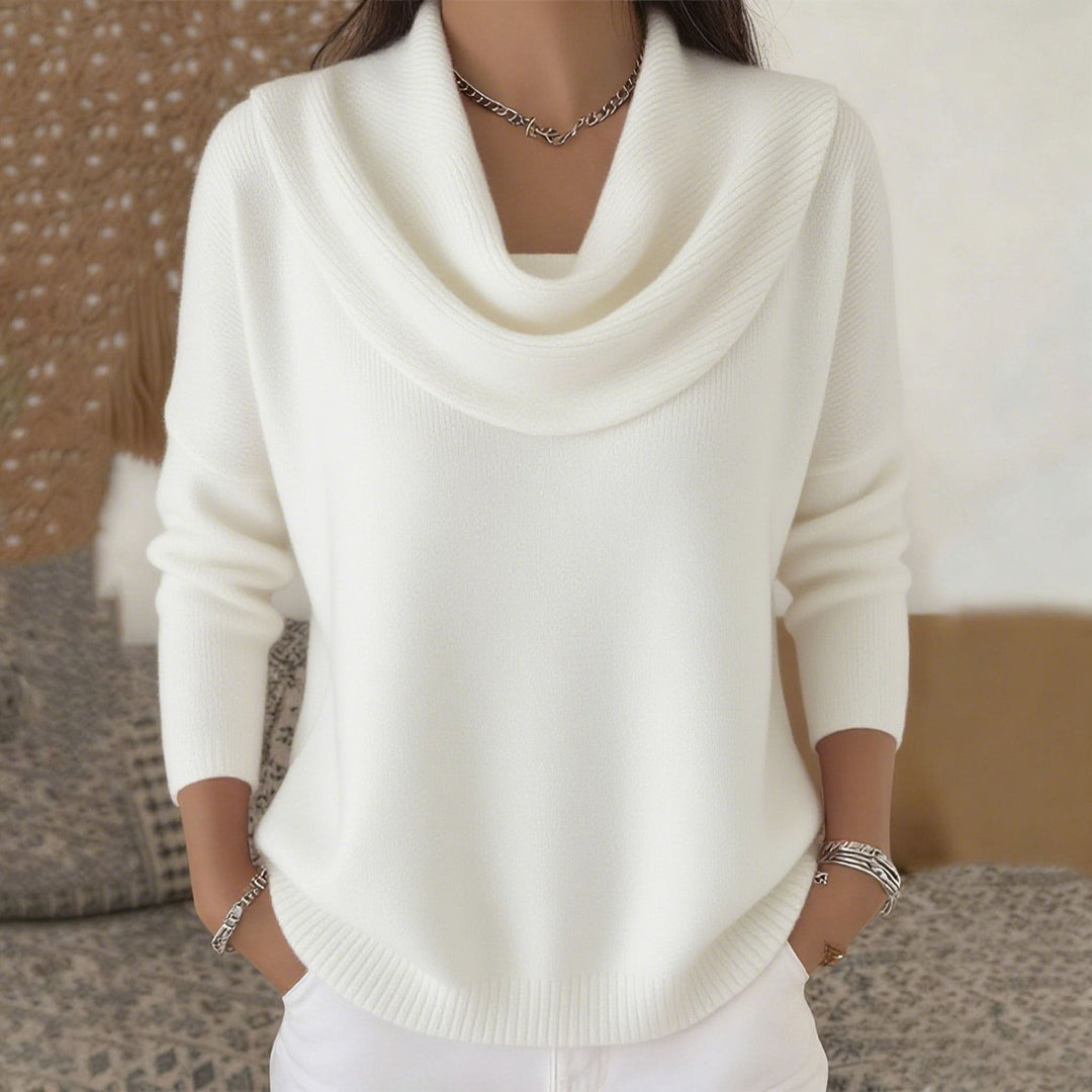 Detail of the cuff and sleeve design on the red Seraphina collared sweater, showcasing craftsmanship.