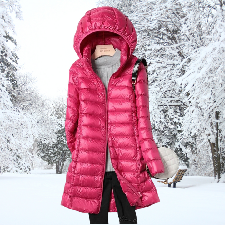 Lifestyle shot of the burgundy Seraphina ultralight down jacket being worn in a casual, urban setting.