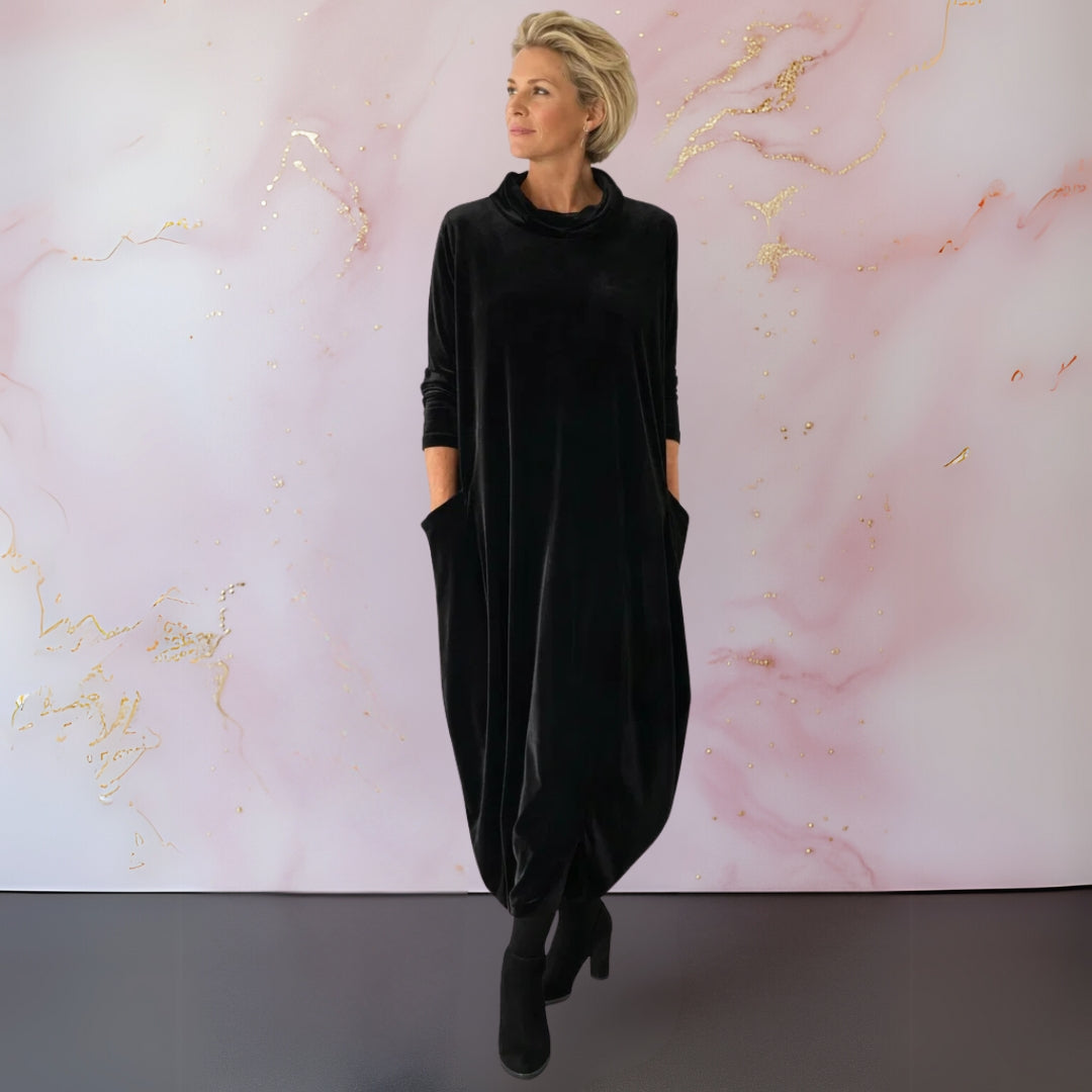 Close-up of the neckline area of the Serena elegant velvet dress, showing the fabric quality.